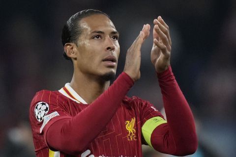 Liverpool's Virgil van Dijk greets fans at the end of the Champions League opening phase soccer match between RB Leipzig and Liverpool at the RB Arena in Leipzig, Germany, Wednesday, Oct. 23, 2024.(AP Photo/Matthias Schrader)