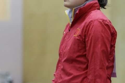 China's Guo Wenjun pauses between shots during qualifiers for the women's 10-meter air pistol event at the 2012 Summer Olympics, Sunday, July 29, 2012, in London. (AP Photo/Rebecca Blackwell)