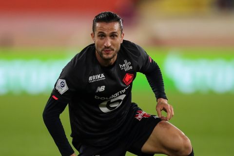 Lille's Yusuf Yazici in action during the French League One soccer match between Monaco and Lille at the Stade Louis II in Monaco, Friday, Nov. 19, 2021. (AP Photo/Daniel Cole)