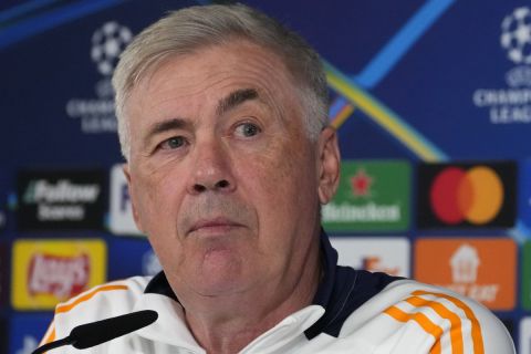 Real Madrid's head coach Carlo Ancelotti listens to a question during a press conference in Madrid, Spain, Monday, Sept. 16, 2024. Real Madrid will play VfB Stuttgart Tuesday in a Champions League soccer match. (AP Photo/Paul White)