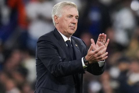 Real Madrid's head coach Carlo Ancelotti applauds to supporters at the end of the Champions League opening phase soccer match between Real Madrid and Borussia Dortmund at the Santiago Bernabeu stadium in Madrid, Tuesday, Oct. 22, 2024. Real Madrid won 5-2. (AP Photo/Manu Fernandez)