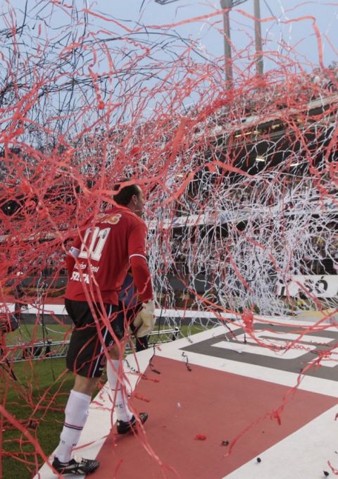 Sao Paulo FC' s goalkeeper Rogerio Ceni is covered by confetti at the end of a Brazilian soccer league game against Atletico Mineiro in Sao Paulo, Brazil, Wednesday, Sept. 7, 2011. Ceni played the 1000th game for this team, Sao Paulo that won 2-1. (AP Photo/Andre Penner)