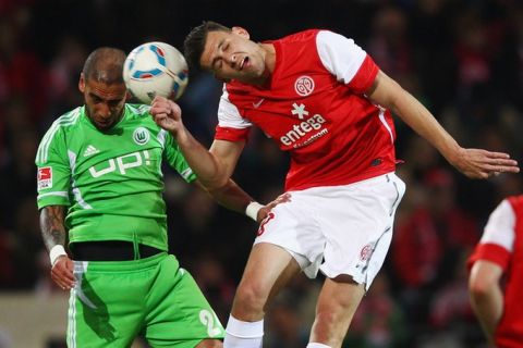 MAINZ, GERMANY - APRIL 20: Adam Szalai (R) of Mainz is challenged by Ashkan Dejagah of Wolfsburg during the Bundesliga match between FSV Mainz 05 and VfL Wolfsburg at Coface Arena on April 20, 2012 in Mainz, Germany.  (Photo by Alex Grimm/Bongarts/Getty Images)