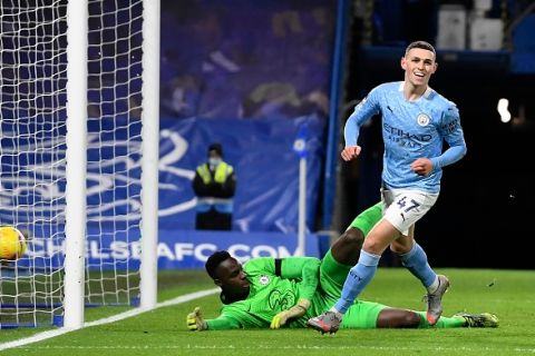 Manchester City's Phil Foden celebrates after scoring his side's second goal during the English Premier League soccer match between Chelsea and Manchester City at Stamford Bridge, London, England, Sunday, Jan. 3, 2021. (AP Photo/Ian Walton/Pool)