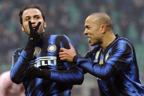 Inter Milan's Giampaolo Pazzini (L) celebrates with teammate Houssine Kharja after scoring against Palermo during their Italian Serie A soccer match at the San Siro stadium in Milan January 30, 2011. REUTERS/Paolo Bona   (ITALY - Tags: SPORT SOCCER)