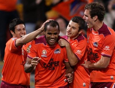 BRISBANE, AUSTRALIA - OCTOBER 16:  Reinaldo of the Roar celebrates  with team mates after scoring a goal during the round 10 A-League match between the Brisbane Roar and the Newcastle Jets at Suncorp Stadium on October 16, 2010 in Brisbane, Australia.  (Photo by Bradley Kanaris/Getty Images)