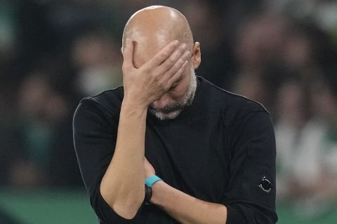 Manchester City's head coach Pep Guardiola reacts during the UEFA Champions League opening phase soccer match between Sporting and Manchester City in Lisbon, Portugal, Tuesday, Nov. 5, 2024. (AP Photo/Armando Franca)