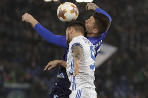 Lazio's Sergej Milinkovic-Savic, right, and Dynamo Kiev's Mykola Morozyuk duels for the ball with during the Europa League round of 16, first-leg soccer match between Lazio and Dynamo Kiev at the Olympic stadium, in Rome Thursday, March 8, 2018. (AP Photo/Gregorio Borgia)