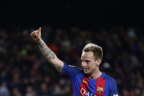 FC Barcelona's Ivan Rakitic celebrates after scoring during the Spanish La Liga soccer match between FC Barcelona and Celta Vigo at the Camp Nou in Barcelona, Spain, Saturday, March 4, 2017. (AP Photo/Manu Fernandez)