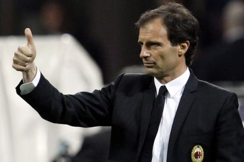 AC Milan's coach Massimiliano Allegri gives a thumbs-up during their Italian Serie A soccer match against Sampdoria at the San Siro stadium in Milan April 16, 2011.  REUTERS/Alessandro Garofalo (ITALY - Tags: SPORT SOCCER)