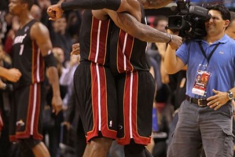 MIAMI, FL - MARCH 10:  Dwyane Wade #3 and LeBron James #6 of the Miami Heat hug after winning a game against  the Los Angeles Lakers at American Airlines Arena on March 10, 2011 in Miami, Florida. NOTE TO USER: User expressly acknowledges and agrees that, by downloading and/or using this Photograph, User is consenting to the terms and conditions of the Getty Images License Agreement.  (Photo by Mike Ehrmann/Getty Images)