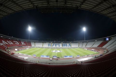 The empty Rajko Mitic stadium is seen before the start the Champions League qualifying play-off first leg soccer match between Red Star and Salzburg, in Belgrade, Serbia, Tuesday, Aug. 21, 2018. The match is played at the empty stadium because of earlier fan trouble. (AP Photo/Darko Vojinovic)