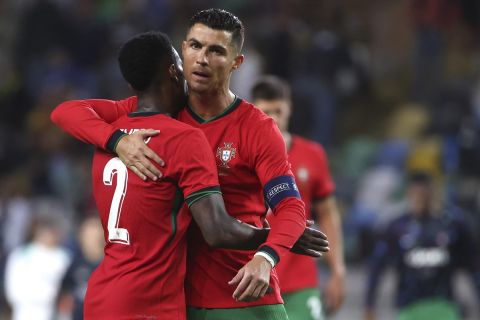 Portugal's Cristiano Ronaldo, right, and Nelson Semedo celebrates during a friendly soccer match between Portugal and Ireland at the Aveiro Municipal stadium in Aveiro, Portugal, Tuesday, June 11, 2024. (AP Photo/Luis Vieira)