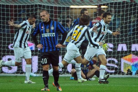 Juventus' forward Mirko Vucinic (R) celebrates after scoring against Inter Milan during the Italian serie A football match at the San Siro stadium in Milan on October 29, 2011. AFP PHOTO / OLIVIER MORIN (Photo credit should read OLIVIER MORIN/AFP/Getty Images)