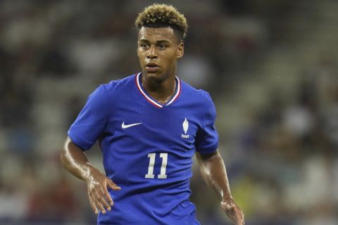 France's Desire Doue participates during a men's group A soccer match between Guinea and France at Nice Stadium at the 2024 Summer Olympics, Saturday, July 27, 2024, in Nice, France. France won 1-0. (AP Photo/Julio Cortez)