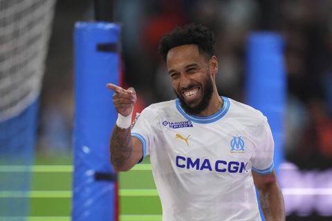 Marseille's Pierre-Emerick Aubameyang celebrates after scoring his side's opening goal during a French League One soccer match between Marseille and Lens at the Stade Velodrome stadium in Marseille, France, Sunday, April 28, 2024. (AP Photo/Daniel Cole)