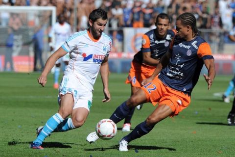 Montpellier's defender Daniel Congre (R) vies with Marseille's  forward Andre-Pierre Gignac (L) during the French L1 football match Montpellier (MHSC) vs Marseille (OM) on August 26, 2012 at the Mosson stadium in Montpellier southern France. AFP PHOTO /SYLVAIN THOMAS        (Photo credit should read SYLVAIN THOMAS/AFP/GettyImages)