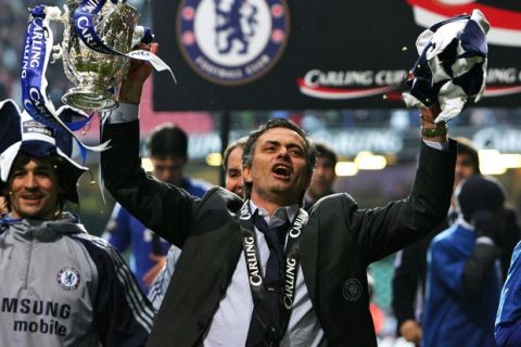 CARDIFF, UNITED KINGDOM: Chelsea manager Jose Mourinho celebrates his team's victory in the English League Cup Final football match against Arsenal at The Millennium Stadium, Cardiff, Wales, 25 February 2007. Chelsea won 2-1. AFP PHOTO / PAUL ELLIS Mobile and website use of domestic English football pictures subject to a subscription of a license with Football Association Premier League (FAPL) tel: +44 207 2981656. For newspapers where the football content of the printed and electronic versions are identical, no license is necessary. (Photo credit should read PAUL ELLIS/AFP/Getty Images)