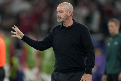 Scotland's manager Steve Clarke gestures during a Group A match between Scotland and Hungary at the Euro 2024 soccer tournament in Stuttgart, Germany, Sunday, June 23, 2024. (AP Photo/Matthias Schrader)