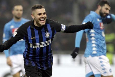 Inter Milan's Mauro Icardi celebrates after his teammate Lautaro Martinez scored during a Serie A soccer match between Inter Milan and Napoli, at the San Siro stadium in Milan, Italy, Wednesday, Dec.26, 2018. (AP Photo/Luca Bruno)