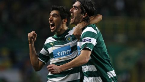 Sporting's Pedro Mendes, right, reacts with Abel Ferreira after scoring his team's second goal against Everton during their Europa League, round of 32, second leg soccer match Thursday, Feb. 25, 2010 at Sporting's Alvalade stadium in Lisbon. (AP Photo/Francisco Seco)