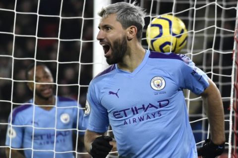 Manchester City's Sergio Aguero celebrates after scoring his side's opening goal during the English Premier League soccer match between Sheffield United and Manchester City at Bramall Lane in Sheffield, England, Tuesday, Jan. 21, 2020. (AP Photo/Rui Vieira)