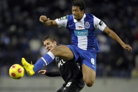 FC Porto's midfielder from Colombia Fredy Guarin (R) vies with Academica's midfielder Brazilian Diogo Gomes (L) during their Portuguese League Cup semi-final football match at the Dragao Stadium in Porto, on February 10, 2010. AFP PHOTO/MIGUEL RIOPA (Photo credit should read MIGUEL RIOPA/AFP/Getty Images)