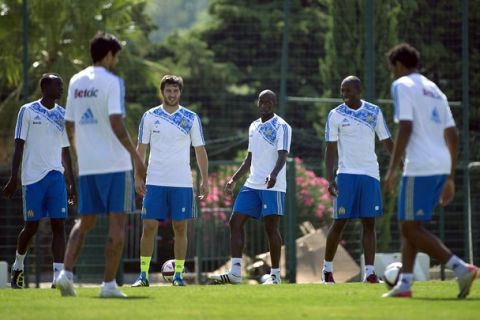 Olympique de Marseille's players Souleymane Diawara (3rdL) and Andre-Pierre Gignac practice during a training session at the Robert Louis-Dreyfus football training centre in Marseille on August 4, 2011. Marseille will face Sochaux on the opening day of the French L1 season. AFP PHOTO BERTRAND LANGLOIS (Photo credit should read BERTRAND LANGLOIS/AFP/Getty Images)