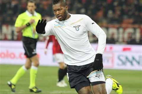 Lazio's Djibril Cisse, of France, celebrates after scoring during the Italian Cup quarter-final soccer match between AC Milan and Lazio, at the San Siro stadium in Milan, Italy, Thursday, Jan. 26, 2012. (AP Photo/Antonio Calanni)