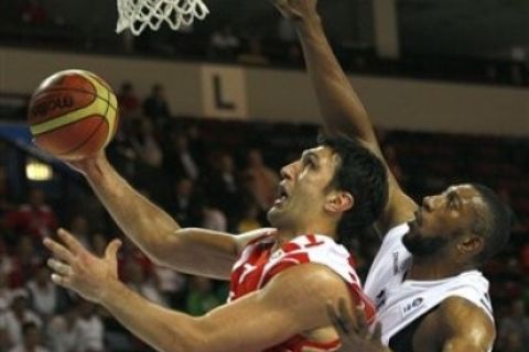 Georgia's Zaza Pachulia, left, challenges for the ball with Belgium's Didier  Ilunga Mbenga, during their EuroBasket European Basketball Championship Group D match in Klaipeda, Lithuania, Wednesday Aug. 31, 2011.(AP Photo/Darko Vojinovic)