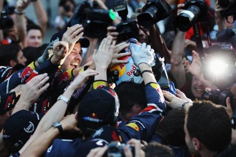 SUZUKA, JAPAN - OCTOBER 09:  Sebastian Vettel of Germany and Red Bull Racing celebrates with team mates after finishing third to secure his second F1 World Drivers Championship during the Japanese Formula One Grand Prix at Suzuka Circuit on October 9, 2011 in Suzuka, Japan.  (Photo by Mark Thompson/Getty Images)