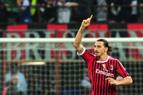 AC Milan's Swedish forward Zlatan Ibrahimovic celebrates after scoring a penalty during their Serie A football match between AC Milan and AS Roma at San Siro Stadium in Milan on March 24, 2012. 
AFP PHOTO / GIUSEPPE CACACE (Photo credit should read GIUSEPPE CACACE/AFP/Getty Images)