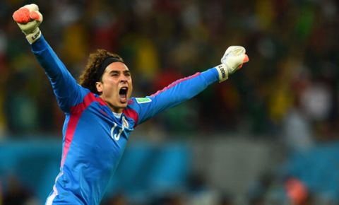 RECIFE, BRAZIL - JUNE 23:  Guillermo Ochoa of Mexico celebrates his team's first goal during the 2014 FIFA World Cup Brazil Group A match between Croatia and Mexico at Arena Pernambuco on June 23, 2014 in Recife, Brazil.  (Photo by Jamie McDonald/Getty Images)