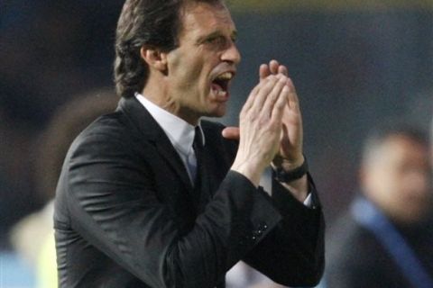 AC Milan coach Massimiliano Allegri gestures during the Serie A soccer match between Brescia and AC Milan at the Rigamonti stadium in Brescia, Italy, Saturday, April 23, 2011. (AP Photo/Antonio Calanni)