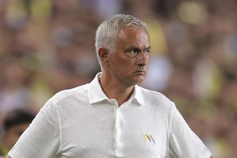 Fenerbahce's head coach Jose Mourinho stands on the pitch during the Turkish Super Lig soccer match between Fenerbahce and Adana Demirspor in Istanbul, Saturday, Aug. 10, 2024. (AP Photo)