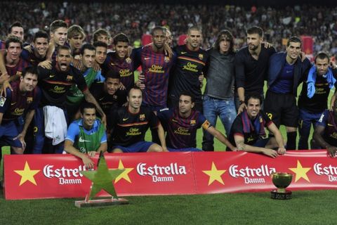 Barcelona's players pose with a trophy after wins their 46th Trophy Joan Gamper friendly football match against Napoli at Camp Nou stadium in Barcelona on August 22, 2011. AFP PHOTO / JOSEP LAGO (Photo credit should read JOSEP LAGO/AFP/Getty Images)