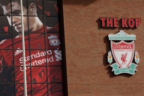 Liverpool Football Club's Anfield Stadium is seen on the day that the club's possible sale has been announced, Liverpool, England, Wednesday Oct. 6, 2010.  Liverpool's board agreed to sell the debt-riddled Premier League soccer  club to the owners of the Boston Red Sox on Wednesday, although legal action may be needed to force the existing American owners out. Current co-owners Tom Hicks and George Gillett Jr. said Tuesday they would resist the bid from New England Sports Ventures, which owns the Red Sox, and a separate bid from Asia because both "dramatically undervalue" the 18-time English champions. (AP Photo/Jon Super)