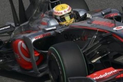 McLaren Mercedes driver Lewis Hamilton of Britain steers his car to take the pole position, during a qualifying session for Sunday's Italian Formula One Grand Prix, at the Monza racetrack, Saturday, Sept. 12, 2009. (AP Photo/Alex Trovati)
