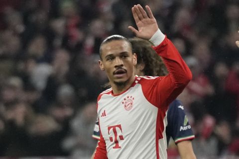 Bayern's Leroy Sane, left, celebrates with his teammate Thomas Mueller after Bayern's Harry Kane scores his side's third goal during the Champions League round of 16 second leg soccer match between FC Bayern Munich and Lazio at the Allianz Arena stadium in Munich, Germany, Tuesday, March 5, 2024. (AP Photo/Matthias Schrader)