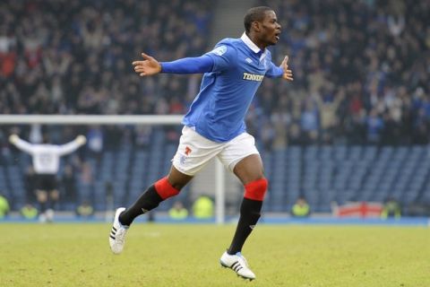 Rangers' Maurice Edu celebrates his goal against Motherwell during their Scottish League Cup semi final soccer match at Hampden Park in Glasgow, January 30, 2011. REUTERS/Russell Cheyne (BRITAIN - Tags: SPORT SOCCER)