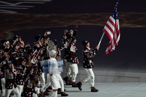 Feb 7, 2014; Sochi, RUSSIA; United States flag bearer Todd Lodwick leads the U.S. Olympic team onto the stage during the opening ceremony for the Sochi 2014 Olympic Winter Games at Fisht Olympic Stadium. Mandatory Credit: Robert Hanashiro-USA TODAY Sports