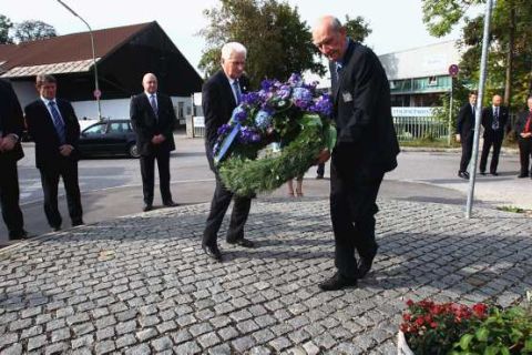 MUNICH, GERMANY - SEPTEMBER 27:  Tony Book (L) former Manchester City manager and Bernard Hatford (R), Life President of Manchester City lay a wreath at the memorial stone in memory of the victims of the 1958 Munich Air Disaster at the old Munich-Riem airport at the Manchesterplatz on September 27, 2011 in Munich, Germany.  Manchester City representatives laid a wreath at a ceremony in memory of the victims of the 1958 Munich Air Disaster which claimed the lives of 23 people, including eight Manchester United players.  (Photo by Alexander Hassenstein/Bongarts/Getty Images)