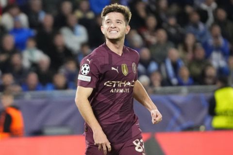 Manchester City's James McAtee celebrates after scoring his side's fourth goal during the Champions League opening phase soccer match between Slovan Bratislava and Manchester City in Bratislava, Slovakia, Tuesday, Oct. 1, 2024. (AP Photo/Petr David Josek)