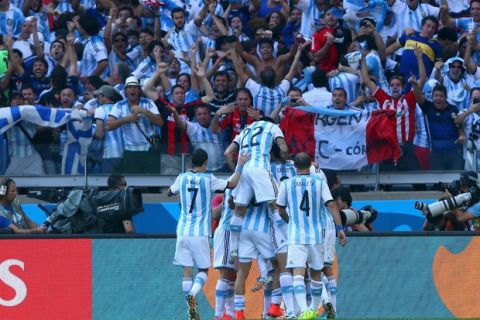 BELO HORIZONTE, BRAZIL - JUNE 21:  Lionel Messi of Argentina celebrates with teammates after scoring his team's first goal during the 2014 FIFA World Cup Brazil Group F match between Argentina and Iran at Estadio Mineirao on June 21, 2014 in Belo Horizonte, Brazil.  (Photo by Jeff Gross/Getty Images)