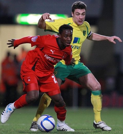 NORWICH, ENGLAND - JANUARY 8 :   Paul-Jose M'Poku of Leyton Orient (L) holds off Russell Martin of Norwich City during the FA Cup sponsored by E.ON 3rd Round match between Norwich City and Leyton Orient at Carrow Road  on January 8, 2011 in Norwich, England.  (Photo by Jan Kruger/Getty Images) *** Local Caption *** Russell Martin;Paul-Jose M'Poku