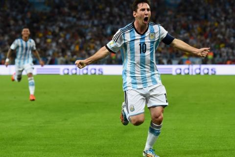 RIO DE JANEIRO, BRAZIL - JUNE 15:  Lionel Messi of Argentina reacts after scoring his team's second goal during the 2014 FIFA World Cup Brazil Group F match between Argentina and Bosnia-Herzegovina at Maracana on June 15, 2014 in Rio de Janeiro, Brazil.  (Photo by Matthias Hangst/Getty Images)