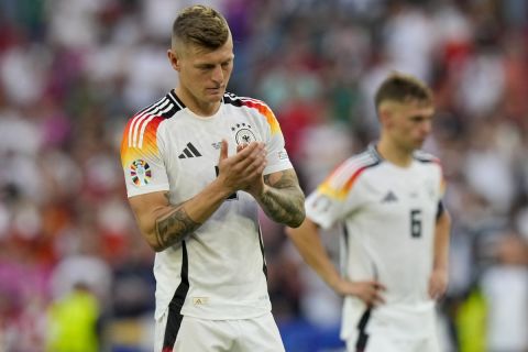 Germany's Toni Kroos clap hands as he acknowledges supporters at the end of a quarter final match between Germany and Spain at the Euro 2024 soccer tournament in Stuttgart, Germany, Friday, July 5, 2024. (AP Photo/Ariel Schalit)