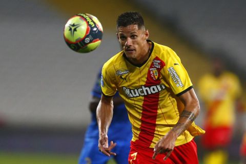 Lens' Florian Sotoca in action during the French League One soccer match between Lens and Reims at the Bollaert stadium in Lens, northern France, Friday, Oct. 1, 2021. (AP Photo/Michel Spingler)