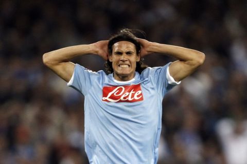 Napoli's Edinson Cavani reacts after missing a goal opportunity against Udinese during their Italian Serie A soccer match at the San Paolo stadium in Naples April 17, 2011. REUTERS/Giampiero Sposito (ITALY - Tags: SPORT SOCCER)