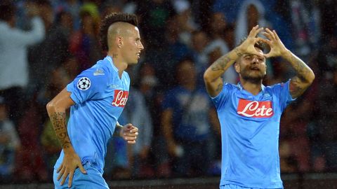 Napoli's forward Lorenzo Insigne (R) celebrates with teammate Napoli's midfielder Marek Hamsik of Slovakia after scoring during the group F Champions League football match SSC Napoli vs Borussia Dortmund on September 18, 2013. At San Paolo stadium in Naples. AFP PHOTO / ALBERTO PIZZOLI        (Photo credit should read ALBERTO PIZZOLI/AFP/Getty Images)